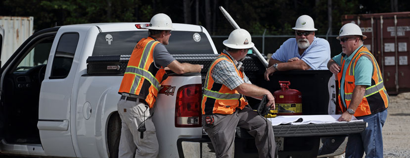 home-image-1 Shell McElroy team in a truck on a construction site